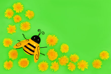 Dandelion flower food for bees with garden ornament. Important for bee pollen nectar and insect pollination. Environmental conservation nature concept. Health food for natural herbal plant medicine.の写真素材