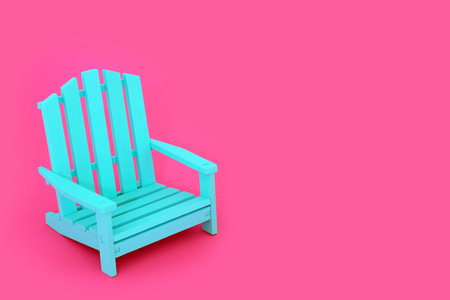 Time to relax composition with modern blue wooden slatted chair on vivid pink background. Minimal contemporary stylish furniture colour contrast concept.の写真素材