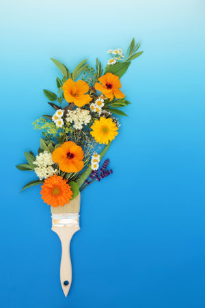 Surreal painting with summer herbs and flowers concept with paintbrush. Abstract Summer floral minimal eco symbol nature design on gradient blue white background. Flat lay.の写真素材