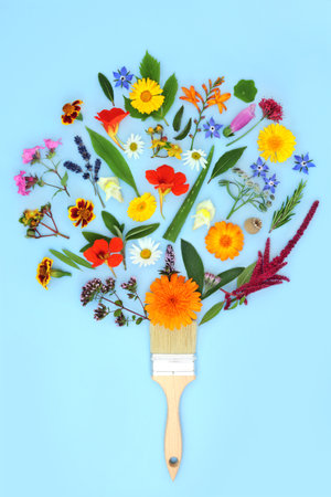 Surreal paintbrush splash concept with summer flowers, wildflowers and herbs. Medicinal herbal plant medicine, abstract healing floral nature concept on pastel blue background.の写真素材