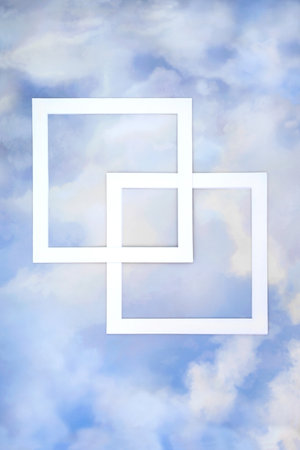 Abstract blue sky cloud background border with two square white frames. Minimal geometric nature weather creative concept. Flat lay.の写真素材