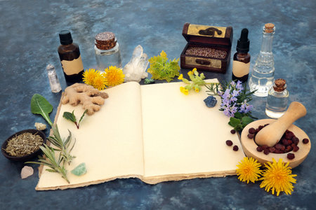 Naturopathic herbal plant medicine for natural healing with hemp recipe book, essential oils, crystals, herbs flowers. Old fashioned alternative magical pagan composition for flower remedies.の写真素材