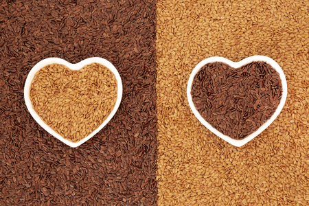 Flax seed healthy heart food for low cholesterol, blood pressure and blood sugar. Also helps with IBS, is a natural laxative rich in nutritional goodness. Natural health food golden and brown types.の写真素材