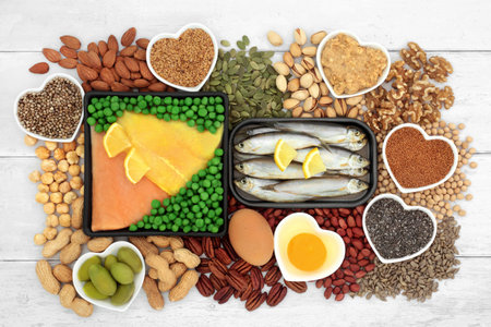 Health food for a healthy heart high in lipids containing essential fatty acids unsaturated good fats for low cholesterol levels with fish, dairy, vegetables, nuts, seeds and legumes.の写真素材