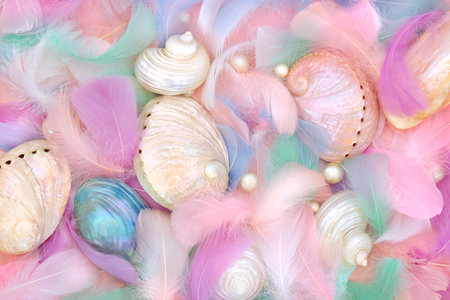 Mother of pearl seashells, feathers and oyster pearls. Abstract beautiful nature background with feminine soft theme.の写真素材