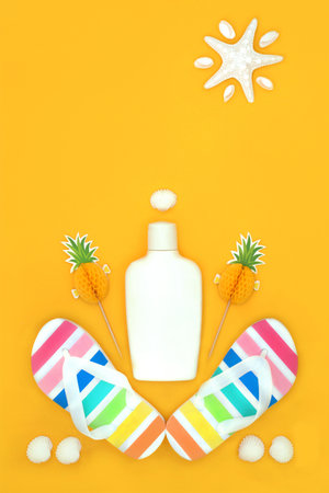 Summer holiday beach accessory essentials with suntan lotion, rainbow flip flops, pineapple cocktail sticks, decorative seashells and starfish sun. Abstract fun design for vacation.の写真素材