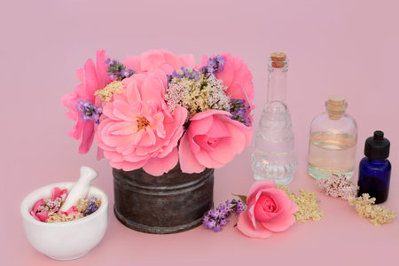 Adaptogen flowers, wildflowers and herbs used in natural herbal medicine and aromatherapy with rose, valerian, elder and lavender flora. Relaxing properties on pink.の写真素材
