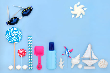 Beach accessories, retro symbols with suntan lotion and swimming goggles protection. Abstract summer travel holiday vacation concept on pastel blue background.の写真素材