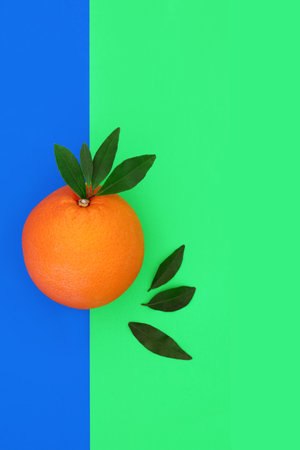 Orange citrus fruit health food abstract design on dual tone blue green background. High in bio flavonoids, antioxidants, vitamin c for immune system boost.の写真素材