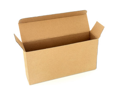 Slimline brown cardboard rectangular shape box on white background. Environmentally friendly recycled reusable material for delivery parcel package.の写真素材