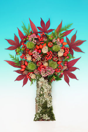 Surreal vivid abstract tree shape design for Autumn Fall Thanksgiving and Samhain harvest festival with leaves, berry fruit, flowers, nuts on gradient turquoise background.の写真素材