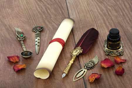 Parchment paper scroll with old feather quill pen, retro brass writing equipment and rose petals for love letter for Valentines Day on rustic wood.の写真素材