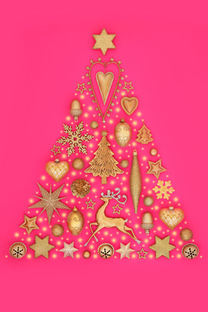 Christmas tree surreal gold bauble decoration with abstract snow. Festive concept symbol for holiday season, greeting card, gift tag, label on pink.の写真素材