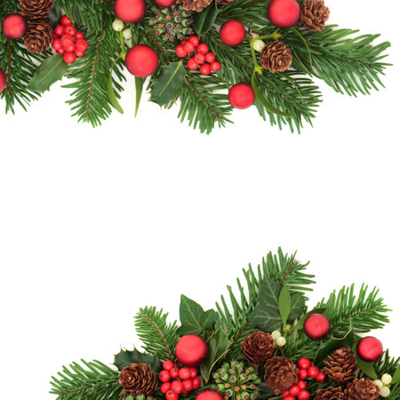 Merry Christmas background border of red bauble decorations and winter flora. Happy holidays festive design for greeting card, label, gift tag, Noel, Yule, winter on white.の写真素材