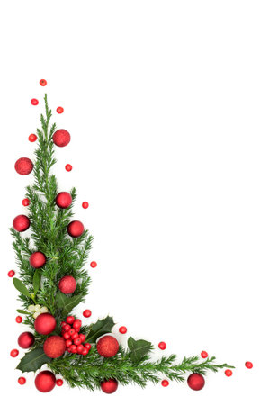 Christmas red bauble background frame with holly berries, mistletoe and winter flora on white background. Design for greeting card, label, invitation, menu, gift tag.の写真素材