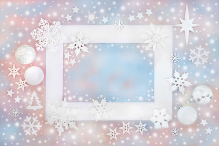Magical Christmas fantasy north pole design with bauble ornaments on blue pink sky background white frame. Festive concept for greeting card, gift tag, label, invitation.の写真素材