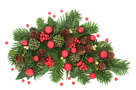 Christmas bauble decorations and winter flora with holly berries, fir, mistletoe, ivy, red berries on white background. Festive green greeting card design for New Year, Yule, Noel.の写真素材