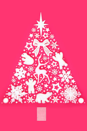 Christmas tree abstract North Pole surreal design on pink with snowflakes and white bauble ornaments. Concept symbol for holiday season, greeting card, gift tag, label.の写真素材