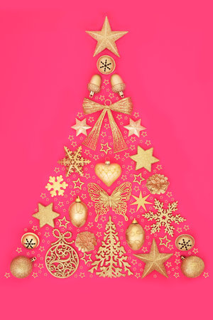 Christmas tree abstract with gold sparkling bauble decorations and stars. Surreal festive concept symbol for holiday season, greeting card, gift tag, label on pink.の写真素材