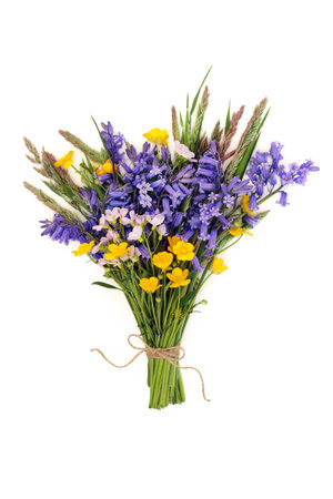 Spring wildflower arrangement posy of British flowers for Beltane on white background. Floral nature composition.の写真素材