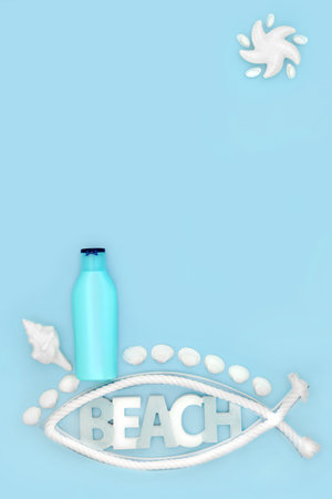 Suntan lotion for summer skincare protection concept with container bottle, beach sign, decorative symbols on blue background. Anti cancer holiday travel health concept.の写真素材