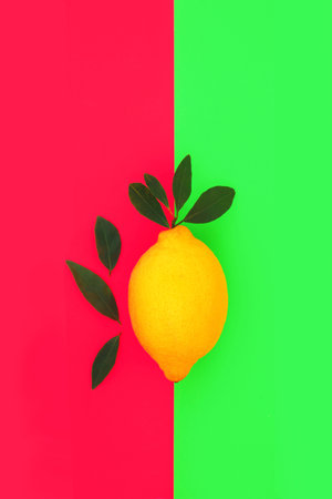Lemon citrus fruit health food for immune system boost. Abstract design on red and green dual tone background. High in bioflavonoids, antioxidants, vitamin c.の写真素材
