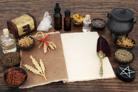 Herbs and magical equipment for natural herbal medicine with book of spells. Witchraft occult esoteric healing concpet. Ancient wicca tradition.の写真素材