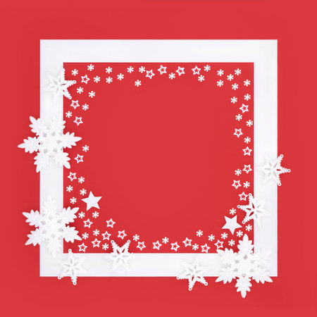 Christmas snowflake and star festive background border on red white frame. Magical enchanting  seasonal abstract design for Xmas, Noel, Yule. Copy space.の写真素材
