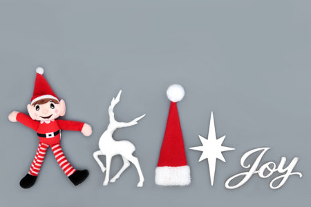 Christmas Eve Joy sign with festive bauble decorations on white background. Xmas fun symbols of elf,...