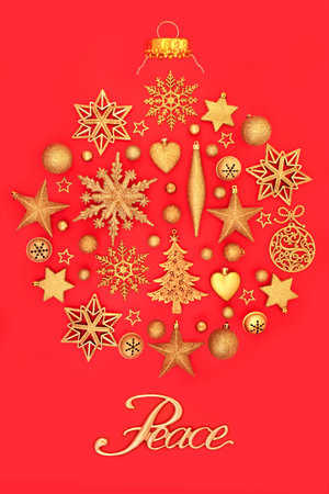 Christmas peace sign abstract surreal gold tree decoration on red. Festive ornaments with peace on earth message for the holiday season. Greeting card, gift tag Xmas composition.の写真素材