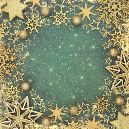 Christmas gold stars, bulb, snowflake decorations on grunge  green background border. Festive holiday season magical decorative design for Xmas New Year, Yule, Noel.の写真素材