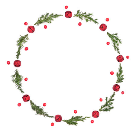 Christmas wreath with fir, red bell baubles and holly berries on white background. Minimal festive design for greeting card, logo, gift tag, invitation. Copy space.の写真素材