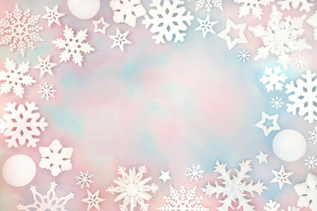 Christmas North Pole theme white frosted snowflakes, stars on sky background border with pink blue clouds. Winter fantasy festive design for holiday season.の写真素材