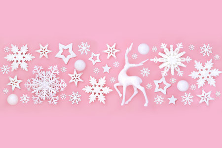 North pole Christmas Eve white reindeer snowflake star bulb fantasy banner on pink background. Magical enchanting bauble decoration pattern for holiday season.の写真素材