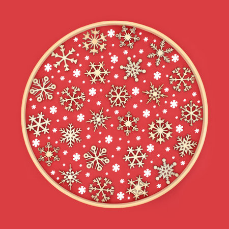 Christmas wooden and white snowflake decorative design on red background with frame. Festive decoration for the Yule, Xmas, Noel holiday season, logo, greeting card.の写真素材