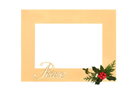 Peace sign with holly and winter greenery christmas background border on white with gold frame. Abstract Peace on Earth theme for New Year and the festive holiday season.の写真素材
