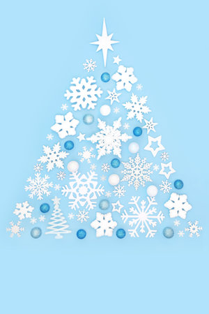 Christmas tree shape abstract fantasy decoration design concept with white, blue bauble ornaments. Festive fun symbol surreal composition. Greeting card for Noel, Xmas, Yule.の写真素材