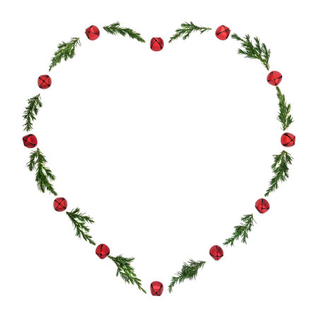 Christmas heart shape juniper and red bell bauble wreath on white background. Minimal symbol of love festive design for greeting card, logo, gift tag, invitation.の写真素材