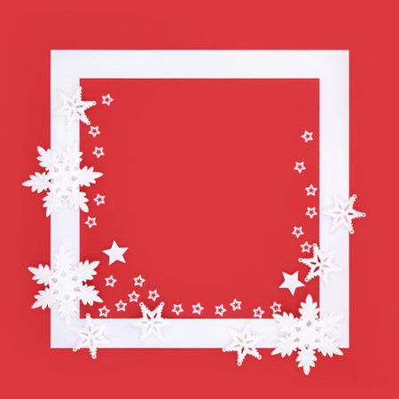Christmas snowflake and star fantasy background border on red, white frame. Festive magical, seasonal abstract design for Xmas, Noel, Yule. Copy space.の写真素材