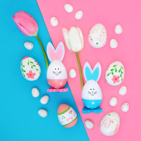 Easter eggs tulip flowers and cute bunny background on pink blue background. Seasonal fun design for greeting card.の写真素材