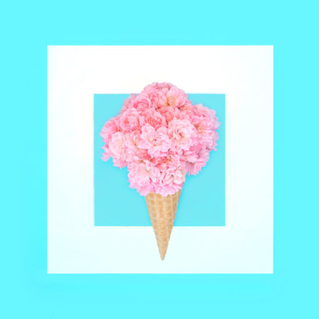 Surreal ice cream cornet surreal fairy rose flower design on blue. Abstract summertime food art composition, gift, greeting card for the holiday season.の写真素材