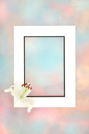 White lily flower with paradise sky background border. Abstract heavenly design for Mothers Day, birthday, greeting card. Spiritual floral beautiful nature composition.の写真素材