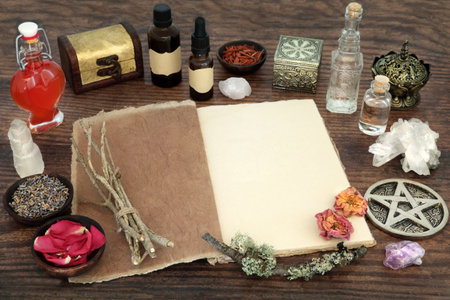 Herbs and magical equipment for alternative herbal medicine with book of spells. Witchcraft occult esoteric healing concept. Ancient wicca tradition.の写真素材