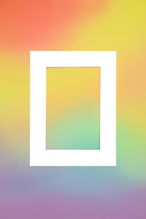 Rainbow spectrum vibrant background with white frame. Colorful design concept.の写真素材