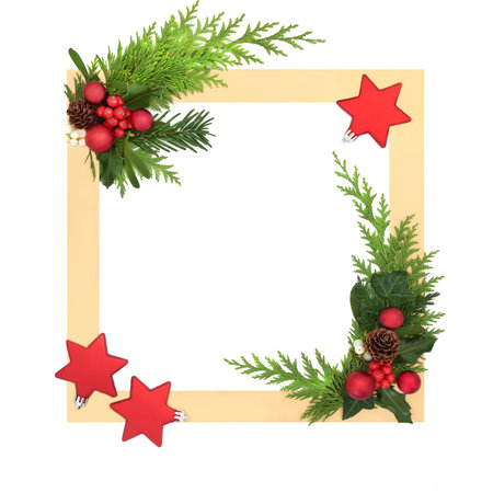 Christmas red tree star ball shape decorations, holly, winter flora on gold border on white background. Festive frame design for Xmas holiday season.の写真素材