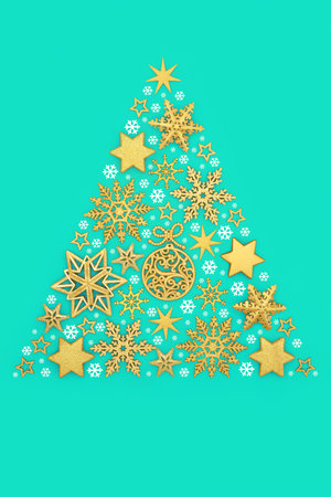 Christmas tree concept shape with gold bauble decorations, white snowflake decorations on turquoise blue background. Surreal abstract symbol for festive season.の写真素材