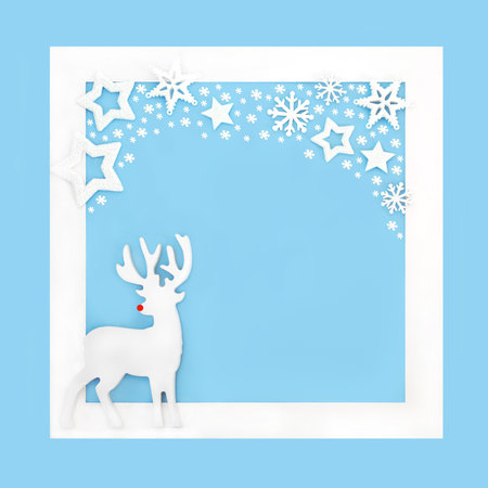 Christmas Rudolph red nose reindeer North Pole theme background on blue with white frame, border. Fantasy magical  festive symbols with snowflakes and stars.の写真素材