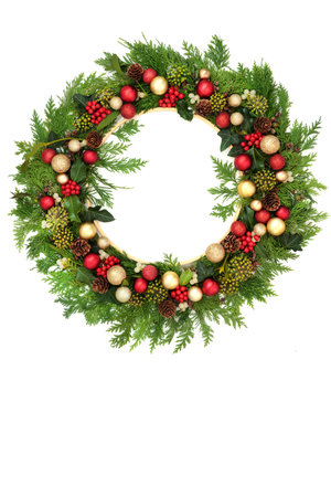Christmas traditional winter greenery wreath decoration, red, gold baubles  holly berries, ivy, mistletoe, fir on white. Festive flora design for Noel Yule Xmas.の写真素材