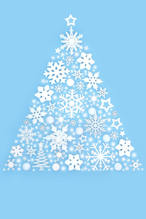 Fantasy Christmas tree shape abstract fantasy decoration design concept with frosted white bauble ornaments on blue background. Festive fun symbol composition.の写真素材