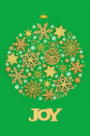 Christmas tree bauble decoration concept shape with joy sign, gold star snowflake decorations on green background. Surreal abstract symbol for festive season.の写真素材